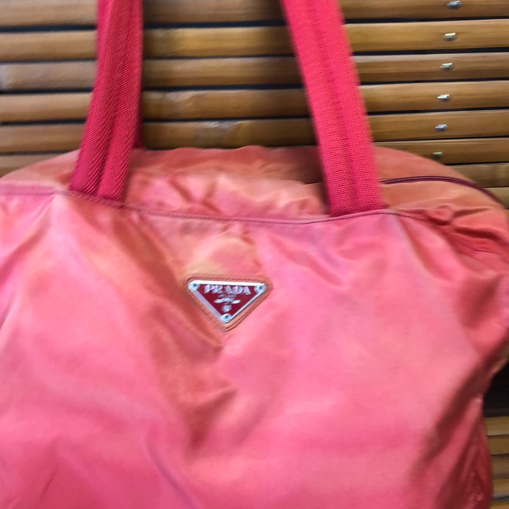 Prada. Authentic 12”x9” reddish/orange bag